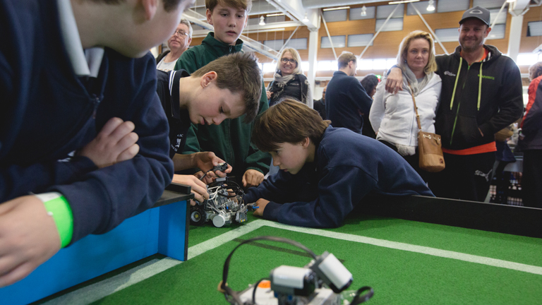 Students preparing for their presentation at the RoboCup