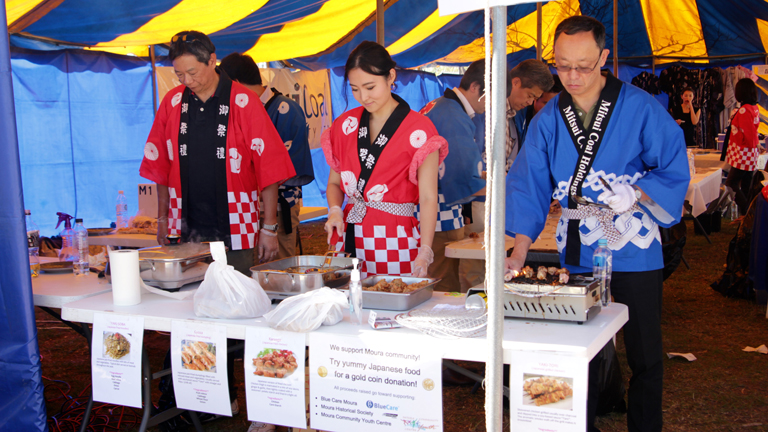 Mitsui volunteers cooking Japanese food for locals