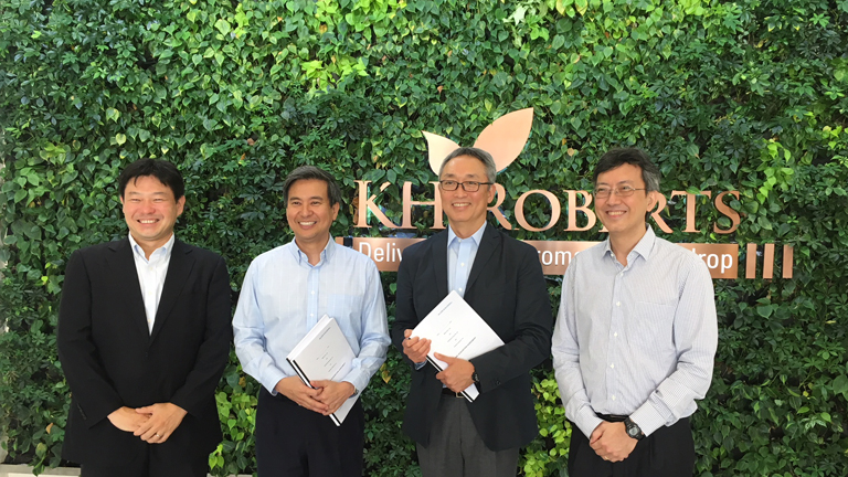 A commemorative photo following the signing ceremony